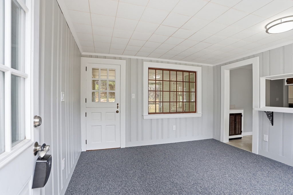11 Sherman's Bridge Road Wayland, MA 01778 - Photo 4 of 38 a view of an empty room with a window