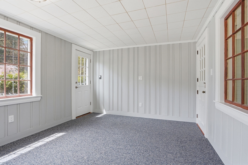 11 Sherman's Bridge Road Wayland, MA 01778 - Photo 5 of 38 an empty room with windows