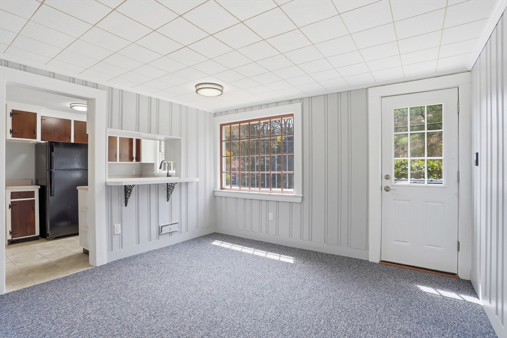 11 Sherman's Bridge Road Wayland, MA 01778 - Photo 6 of 38 an empty room with windows