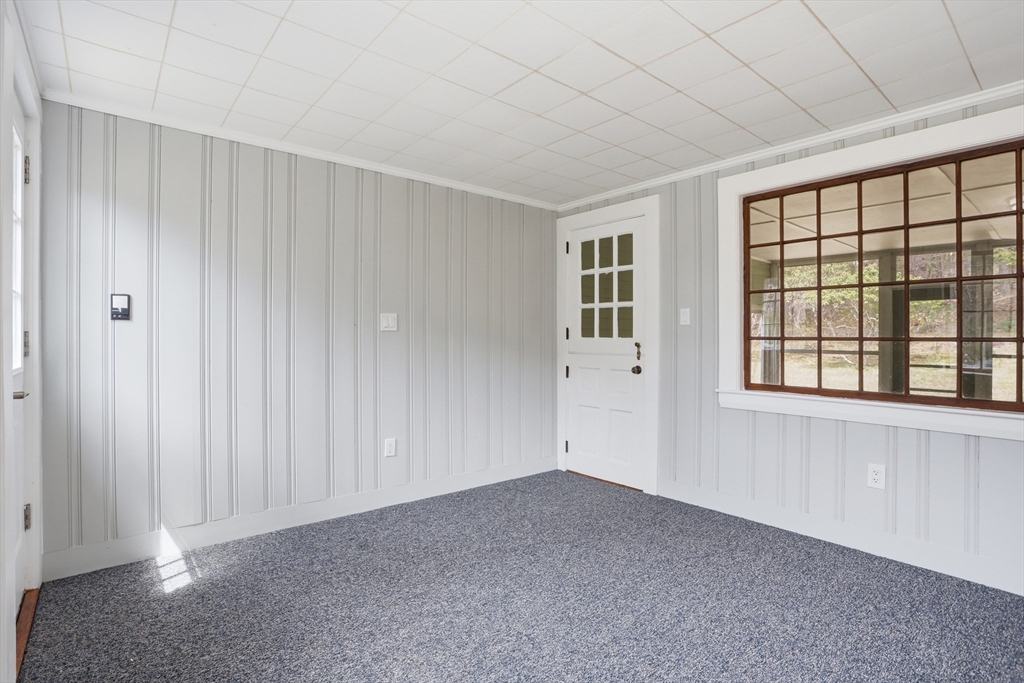 11 Sherman's Bridge Road Wayland, MA 01778 - Photo 7 of 38 a view of an empty room with a window
