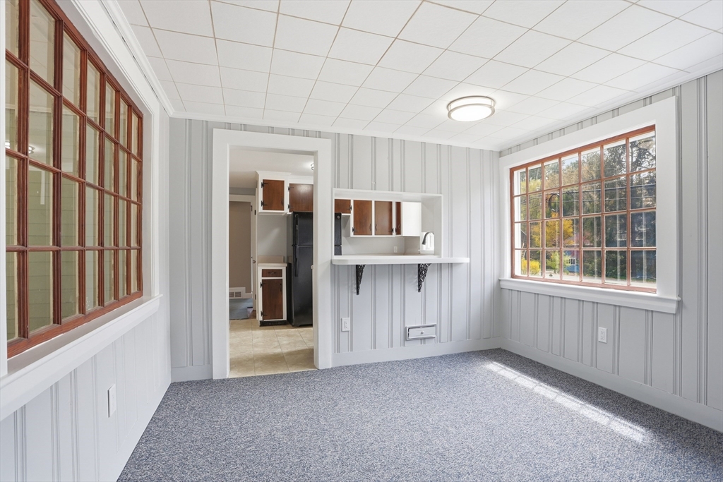 11 Sherman's Bridge Road Wayland, MA 01778 - Photo 8 of 38 a view of an empty room with a window