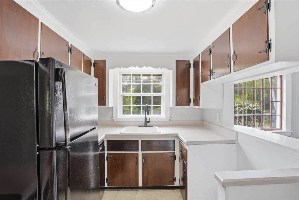 11 Sherman's Bridge Road Wayland, MA 01778 - Photo 9 of 38 a kitchen that has a oven a refrigerator and a window