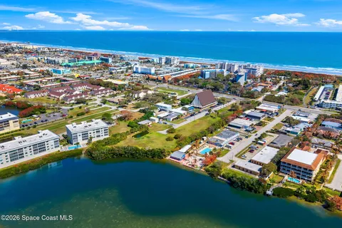 an aerial view of residential house with parking