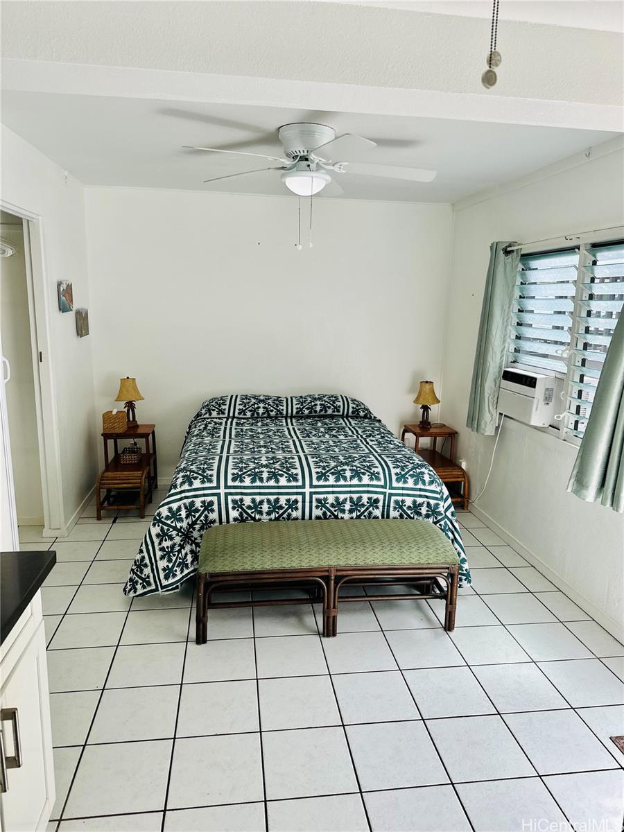 Undisclosed Address Waimanalo, HI 96795 - Photo 3 of 10 a bedroom with a bed and a window