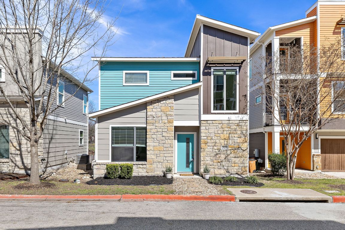 a front view of a house with yard
