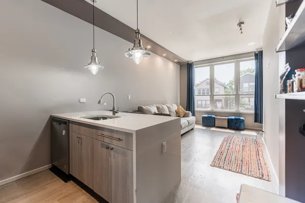 a view of a kitchen with a sink and a window