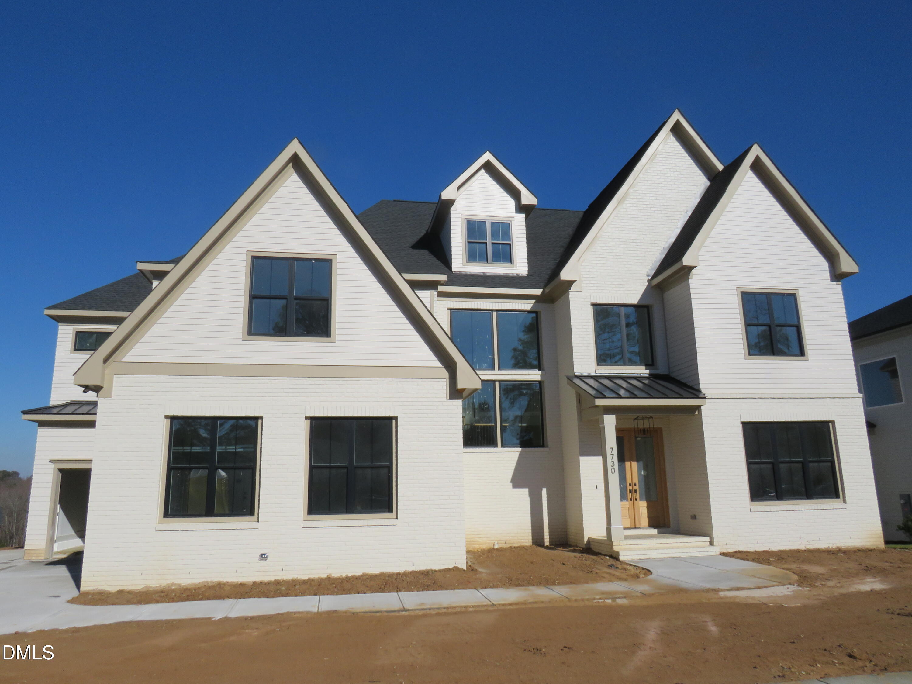 7730 Roberts Road Apex, NC 27523 - Photo 3 of 3 a view of a house with a yard and garage