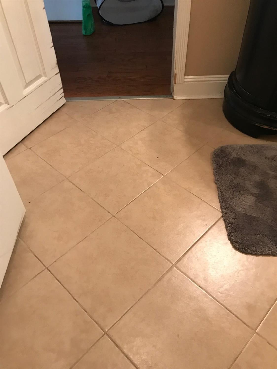 695 Monroe Street Coalinga, CA 93210 - Photo 11 of 60 Tile floor in down stairs bathroom and laundry area combo.
