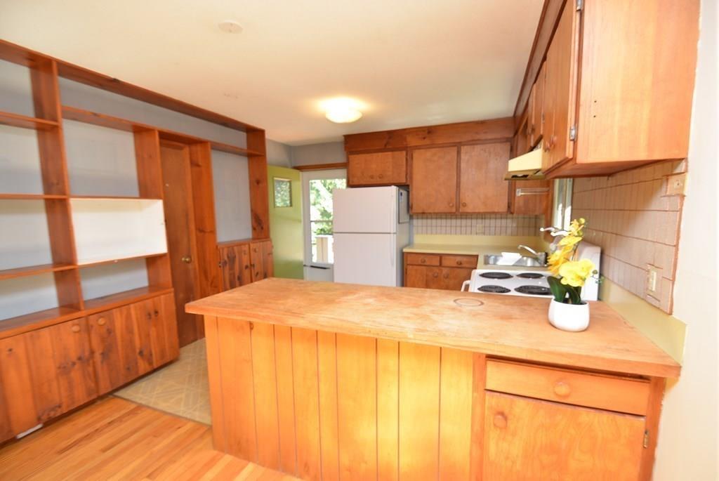 442 Warren Wright Road Belchertown, MA 01007 - Photo 12 of 35 a kitchen with a sink a stove and a refrigerator