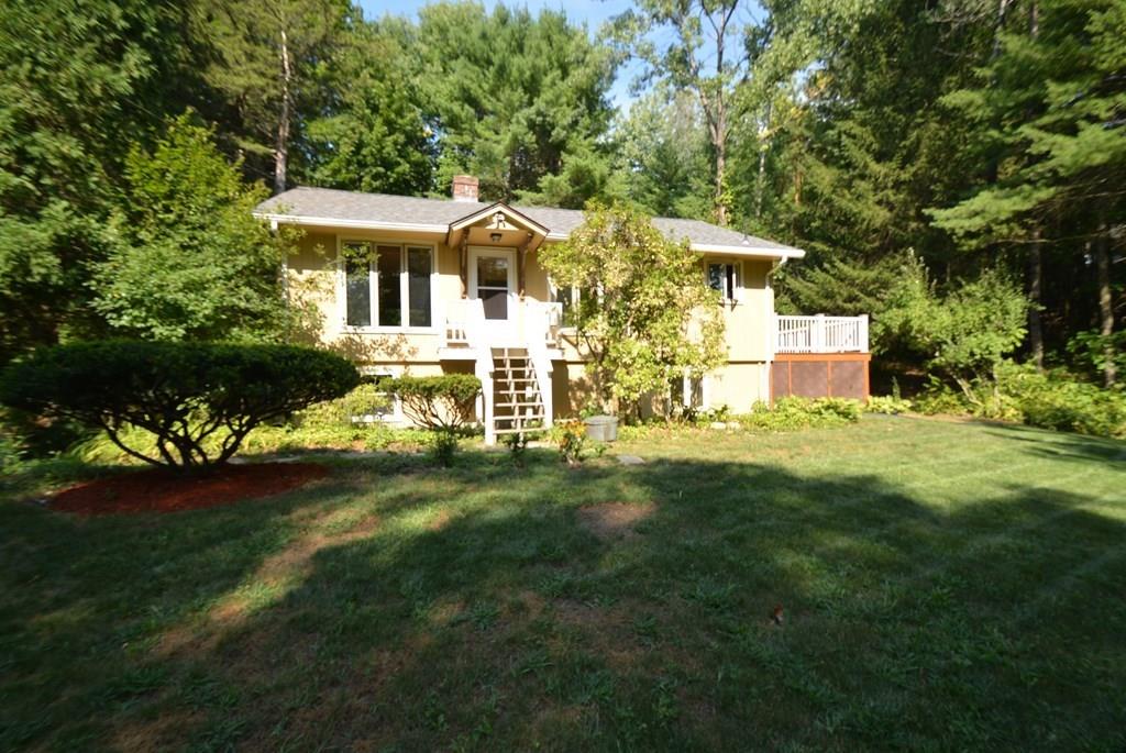 442 Warren Wright Road Belchertown, MA 01007 - Photo 2 of 35 a view of a house with a big yard potted plants and large tree