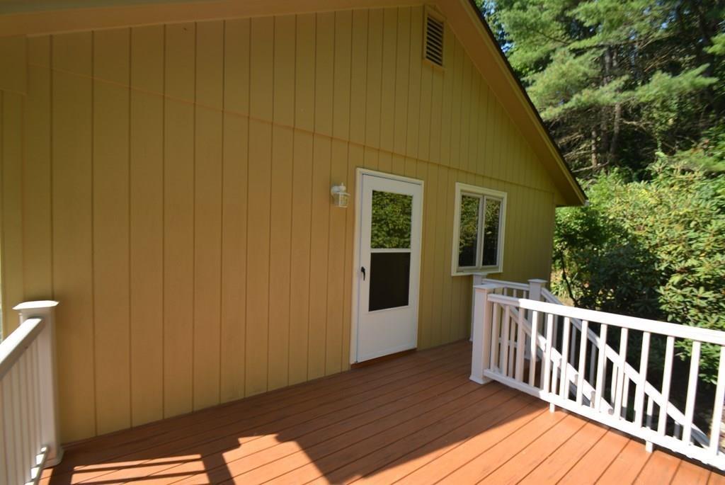 442 Warren Wright Road Belchertown, MA 01007 - Photo 31 of 35 a view of backyard with deck and wooden floor