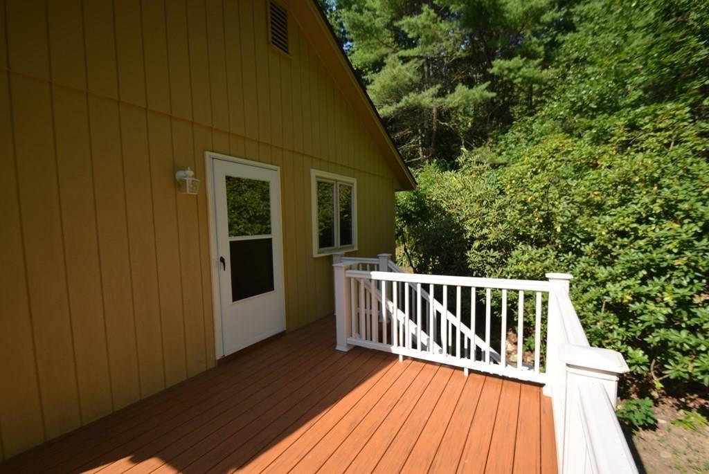 442 Warren Wright Road Belchertown, MA 01007 - Photo 32 of 35 a view of backyard with a deck and wooden floor
