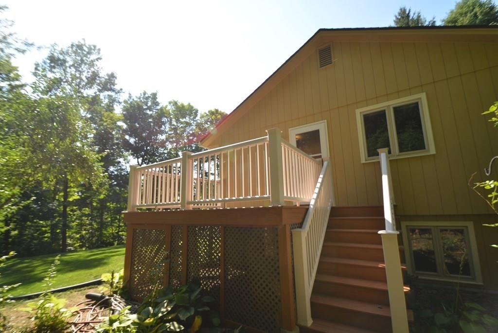 442 Warren Wright Road Belchertown, MA 01007 - Photo 4 of 35 a view of a house with backyard and porch
