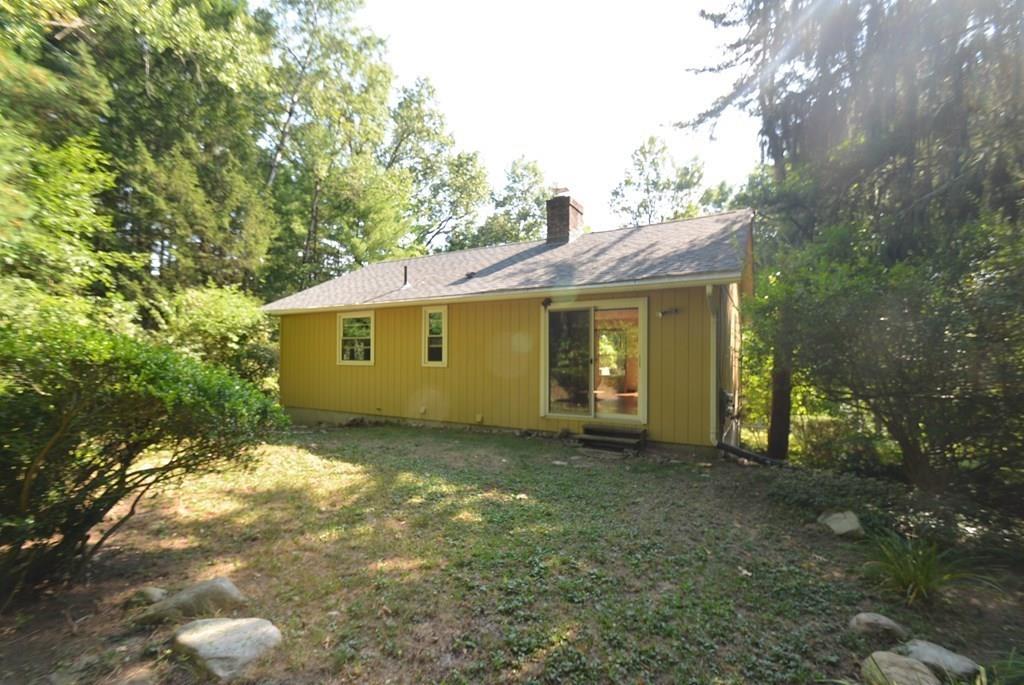 442 Warren Wright Road Belchertown, MA 01007 - Photo 5 of 35 a view of a house with a garden