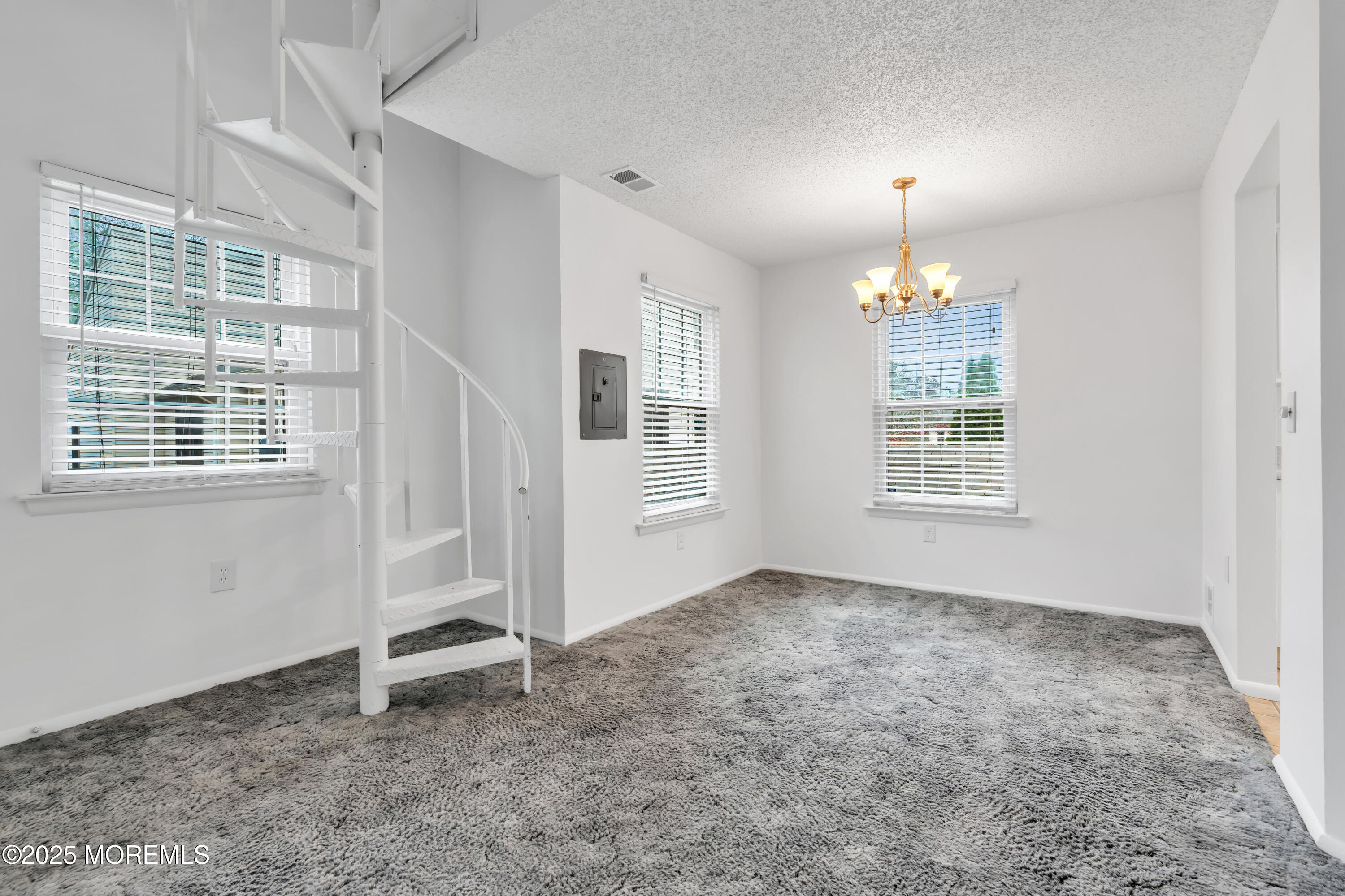 705 Bluebell Drive Jackson, NJ 08527 - Photo 11 of 44 an empty room with windows