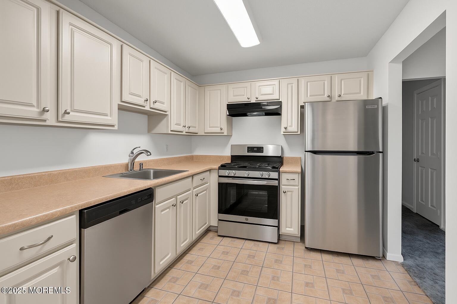 705 Bluebell Drive Jackson, NJ 08527 - Photo 14 of 44 a kitchen with stainless steel appliances granite countertop a refrigerator sink and cabinets