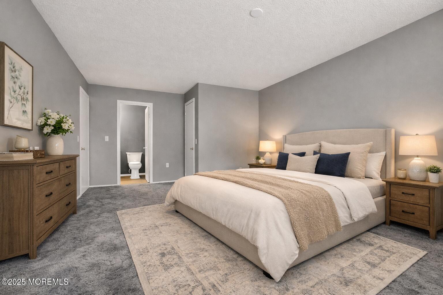 705 Bluebell Drive Jackson, NJ 08527 - Photo 22 of 44 a spacious bedroom with a bed and a lamp