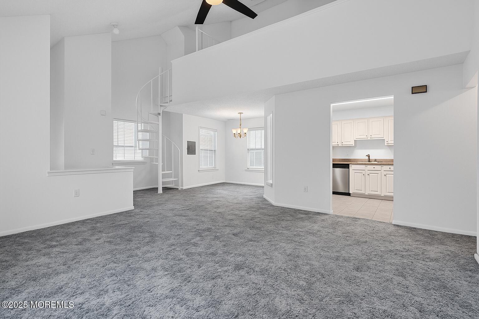 705 Bluebell Drive Jackson, NJ 08527 - Photo 6 of 44 a view of a big room with windows and chandelier fan