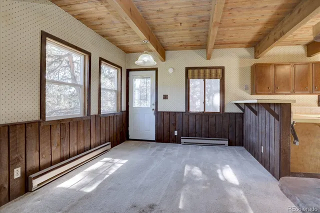 a view of entryway with wooden walls