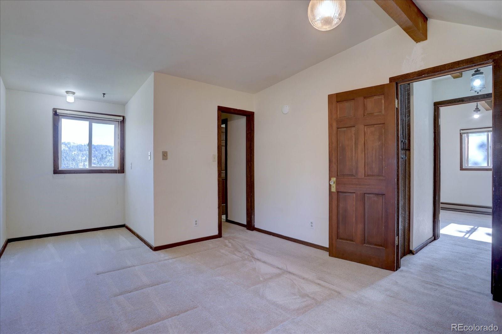 1999 Roland Drive Bailey, CO 80421 - Photo 22 of 33 an empty room with closet area