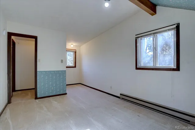 an empty room with windows