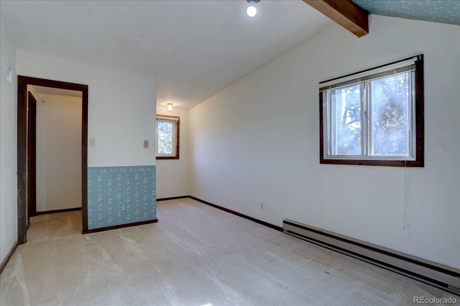 1999 Roland Drive Bailey, CO 80421 - Photo 25 of 33 an empty room with windows