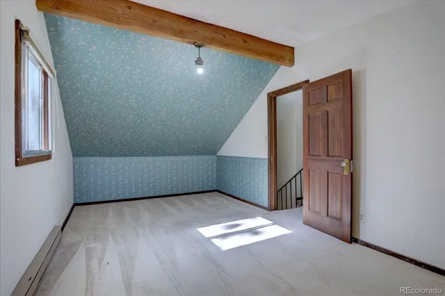 a view of livingroom with stairs and entryway