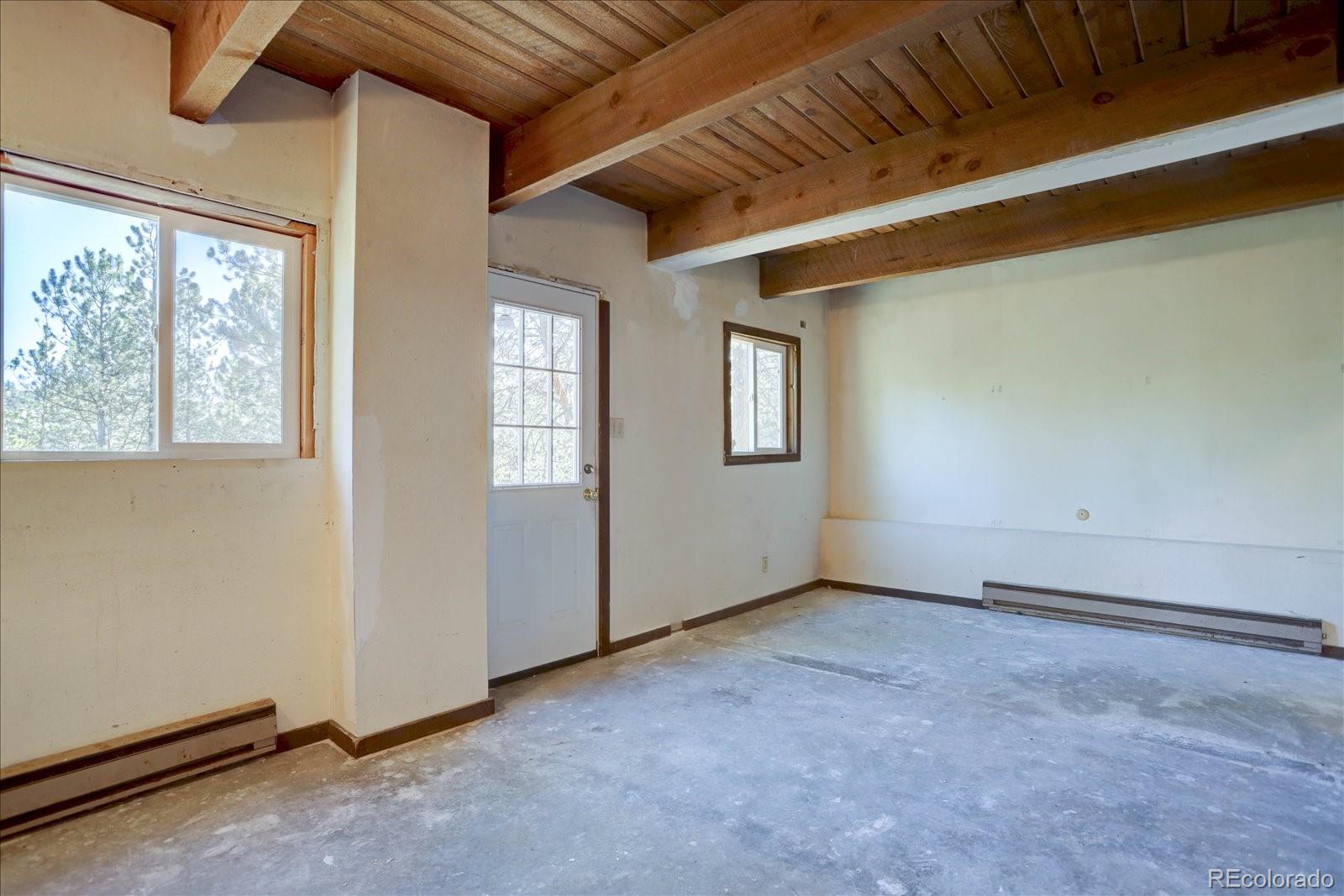 1999 Roland Drive Bailey, CO 80421 - Photo 32 of 33 an empty room with windows