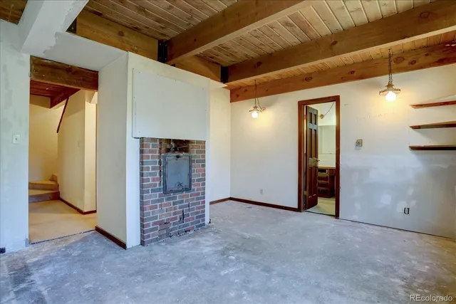 a view of an empty room with closet