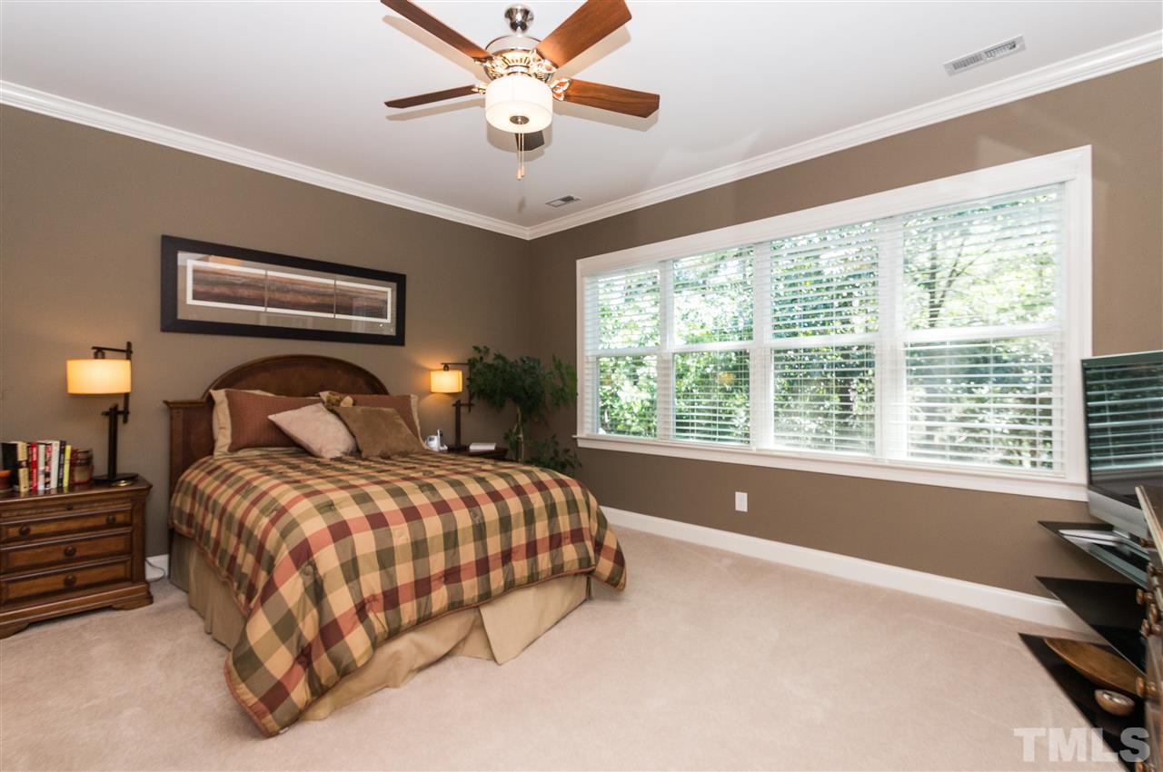 2711 Bembridge Drive Raleigh, NC 27613 - Photo 13 of 25 a bedroom with a large bed and a large window