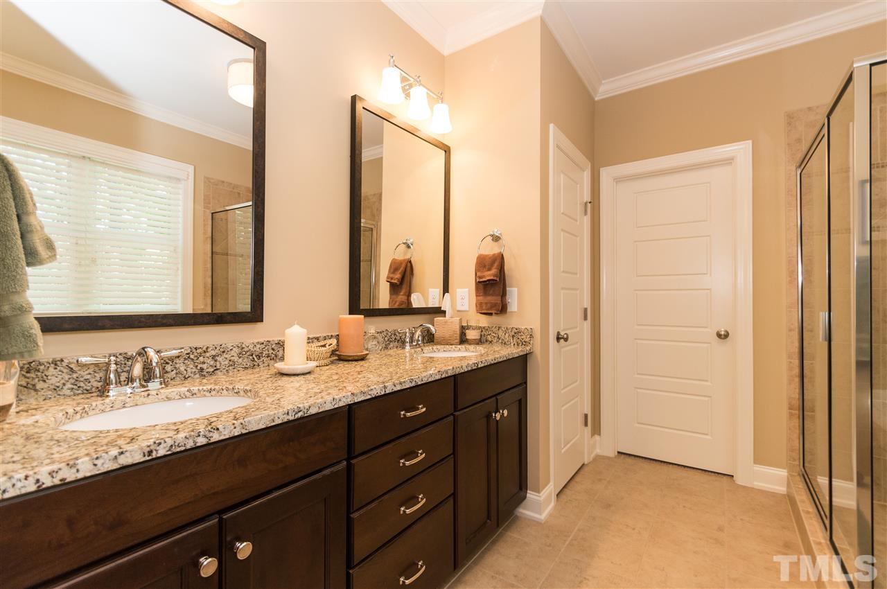 2711 Bembridge Drive Raleigh, NC 27613 - Photo 15 of 25 a bathroom with a granite countertop sink mirror and double