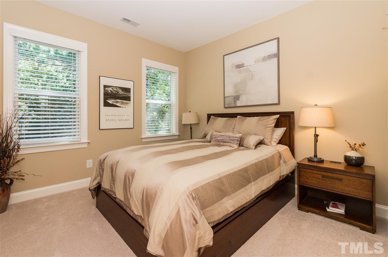 2711 Bembridge Drive Raleigh, NC 27613 - Photo 19 of 25 a bedroom with a bed and a window