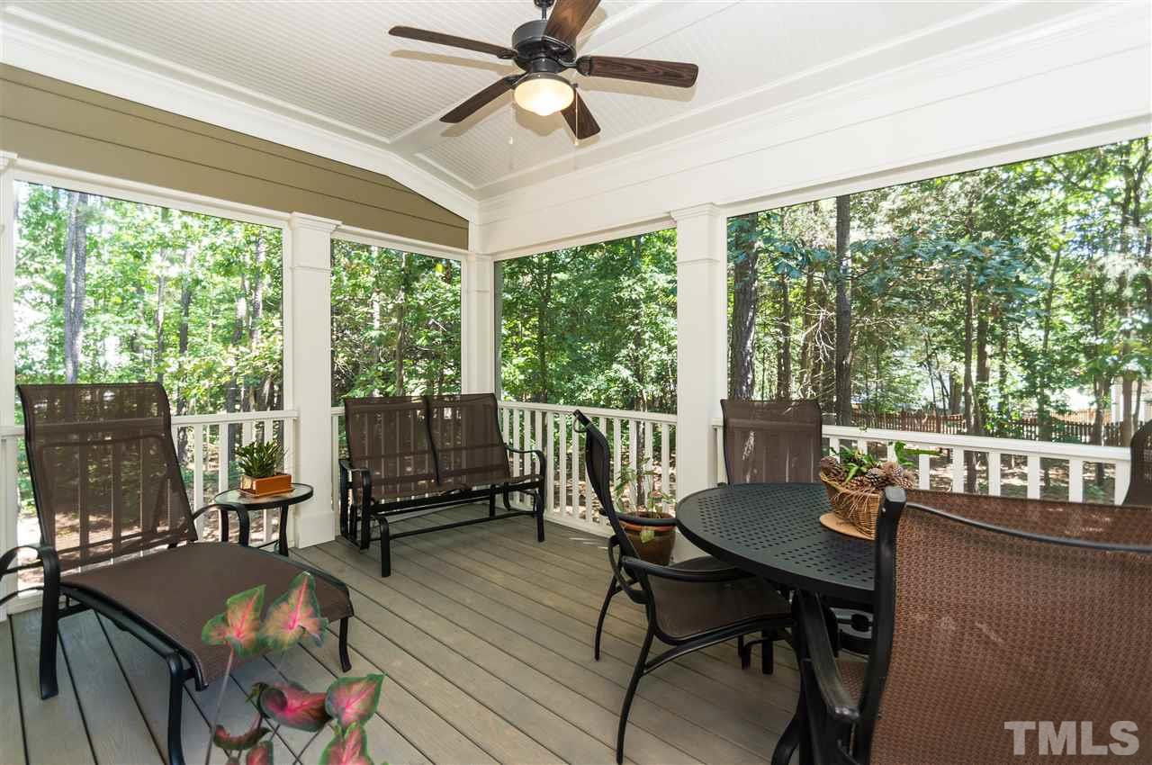 2711 Bembridge Drive Raleigh, NC 27613 - Photo 23 of 25 a living room with furniture and a floor to ceiling window