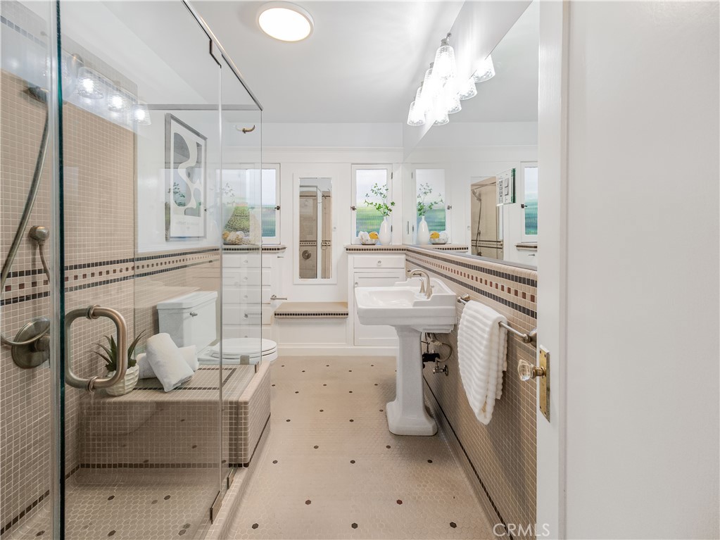 3740 East 5th Street Long Beach, CA 90814 - Photo 16 of 28 a living room with furniture a fireplace and a chandelier