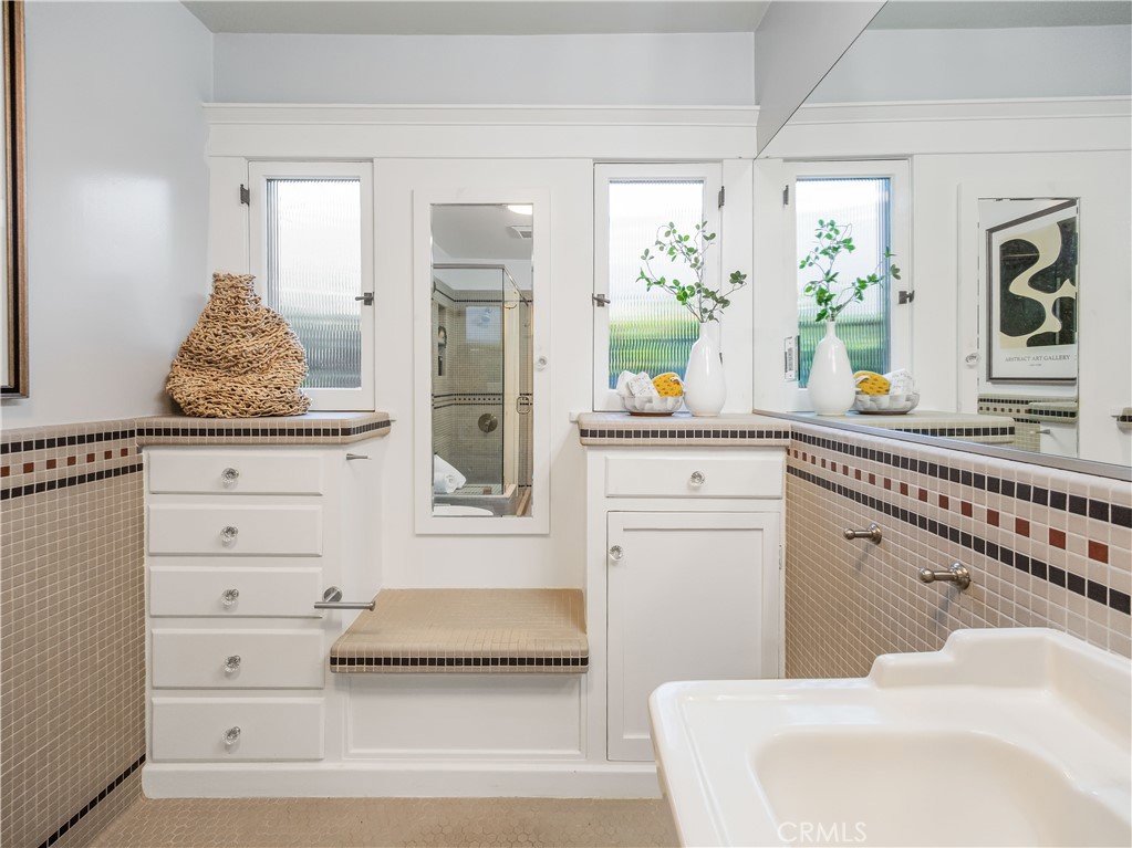 3740 East 5th Street Long Beach, CA 90814 - Photo 17 of 28 a bathroom with a sink and a mirror