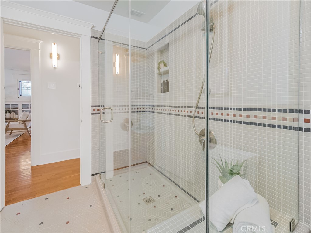 3740 East 5th Street Long Beach, CA 90814 - Photo 18 of 28 a bathroom with a bathtub and a shower