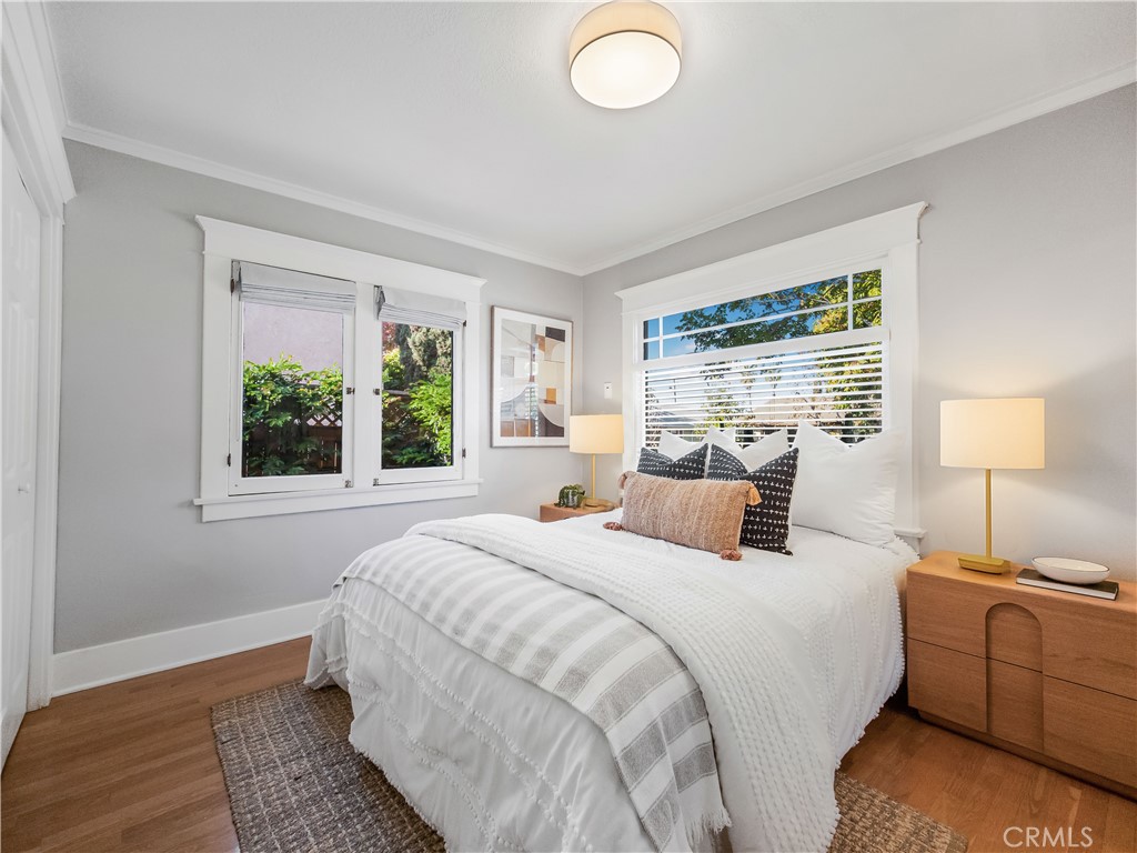 3740 East 5th Street Long Beach, CA 90814 - Photo 19 of 28 a bedroom with a bed and a window