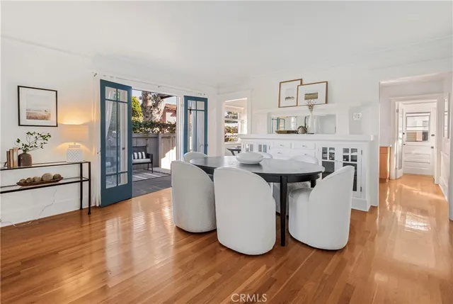 a living room with fireplace furniture and a wooden floor