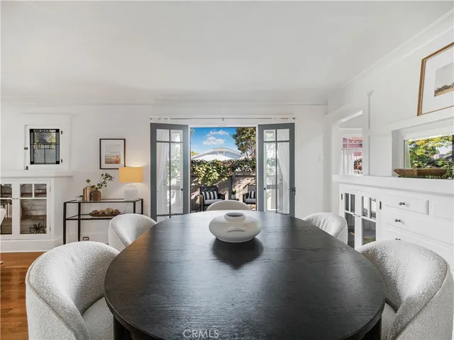 a living room with fireplace furniture and a wooden floor