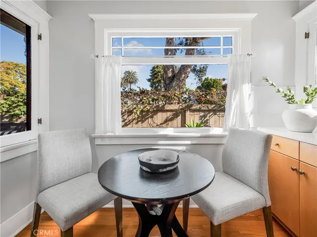 a view of a dining room with furniture and window