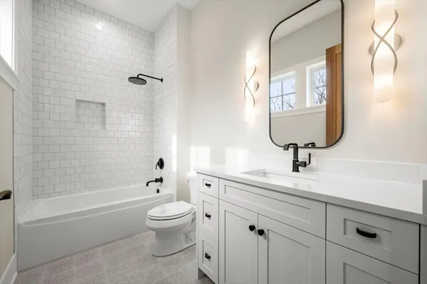 a bathroom with a toilet sink and bathtub