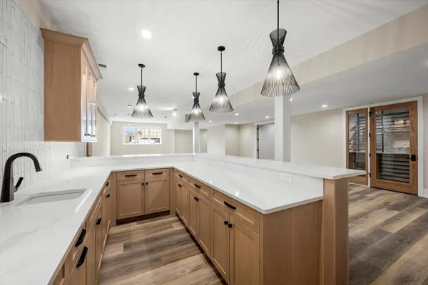 a kitchen with stainless steel appliances granite countertop a sink and dishwasher
