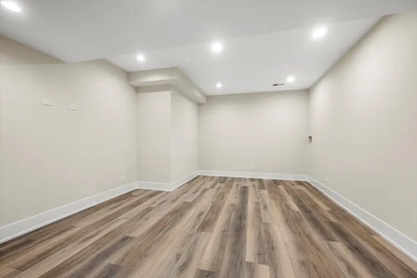 a bathroom with a double vanity sink mirror and shower