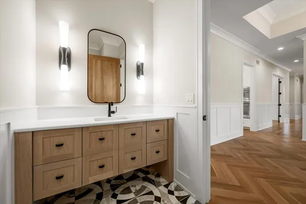 a bathroom with a double vanity sink mirror and