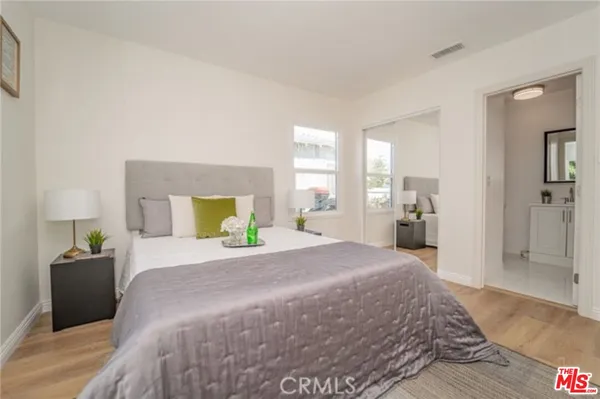 a bedroom with a bed and a dresser