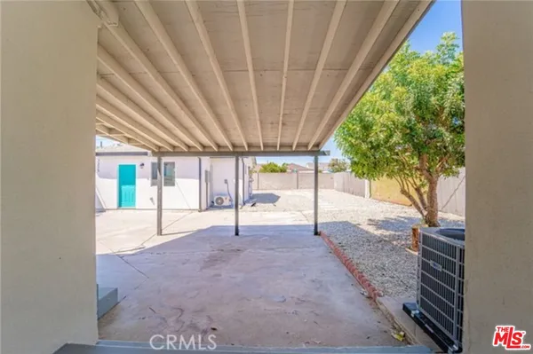 a view of an empty room with a sliding door