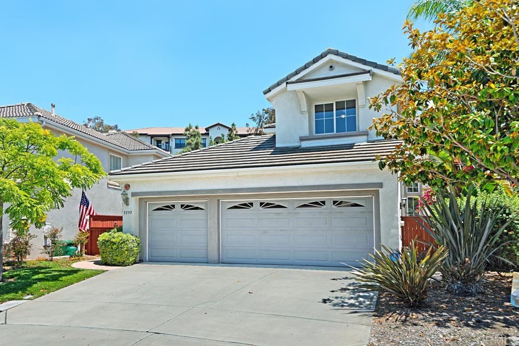 5595 Foxtail Loop Carlsbad, CA 92010 - Photo 28 of 28 a view of a house with a small yard and large tree
