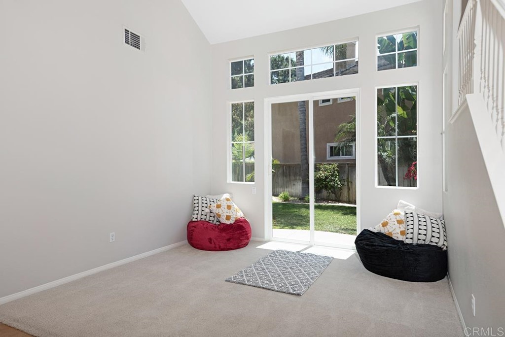 5595 Foxtail Loop Carlsbad, CA 92010 - Photo 4 of 28 a bedroom with a bed and a window