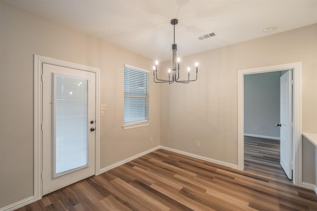 412 Hideaway Road McKinney, TX 75072 - Photo 14 of 40 a view of empty room with wooden floor