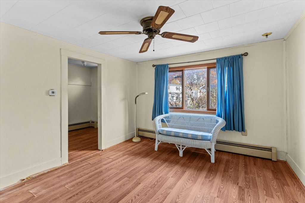 79 Beacon Street Lawrence, MA 01843 - Photo 14 of 29 a bedroom with a bed and a window